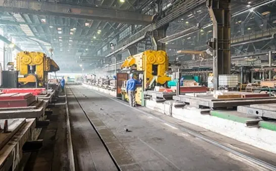View of Saturn Alba Iulia production facility: industrial machinery and molding lines for iron casting parts.